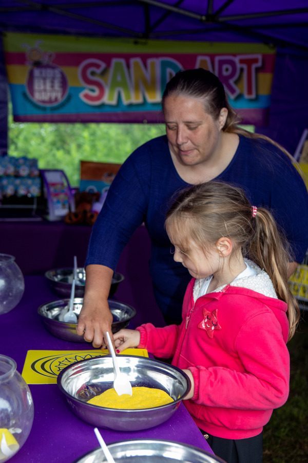 A young person tryng out Sand Art